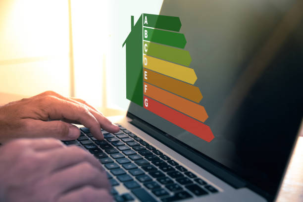 istock Man calculating energy buildings efficiency class. Ecological and bio energetic house concept. 1954592470