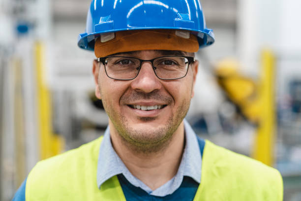 istock Engineer man working inside robotic factory - Automation industry concept 1954596169