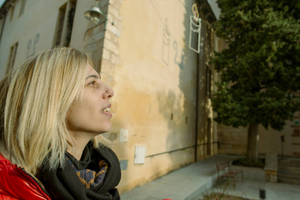 Woman strolling through Peralada, Girona, Spain