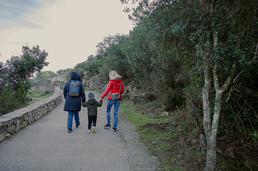 Family strolling through Sant Pere de Rodas, Girona, Spain