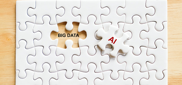 Big data and AI word on puzzle jig saw background, business and technology concept