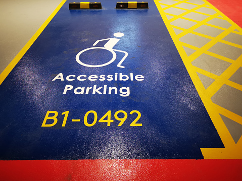 Focus scene on parking lot - accessible parking for physical disability