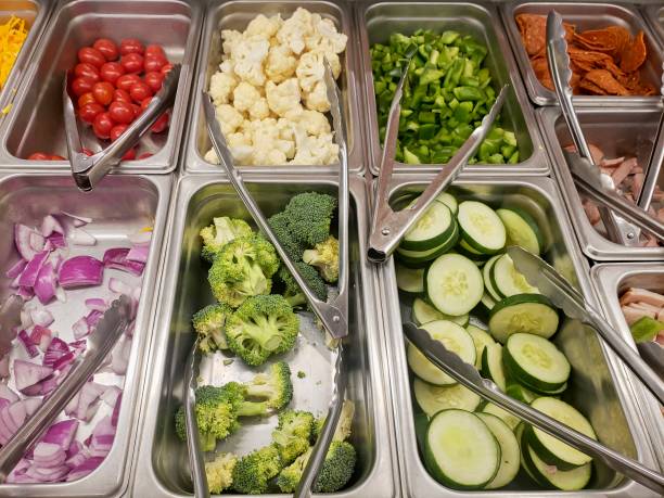 istock Salad and food bar pans with vegetables 1954644113