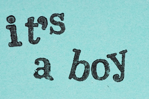 Ink stamp on a blue paper It's a Boy