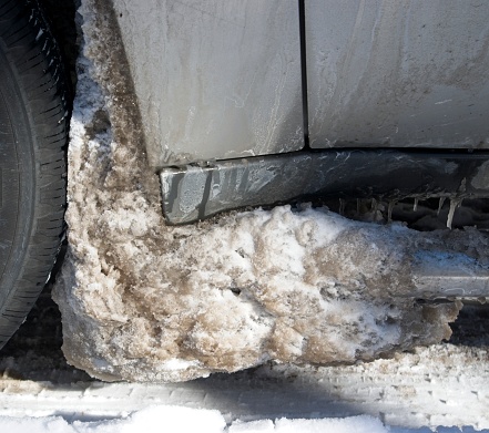 Dirty Snow Buildup between tire and automobile