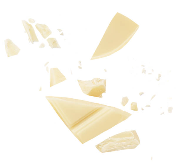 istock White Chocolate explosion isolated on white background. Shattering Chocolate pieces package design. 1954661485