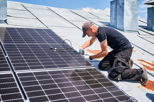 istock Workers building solar panel system on roof of house. Men installing photovoltaic solar module 1954691405