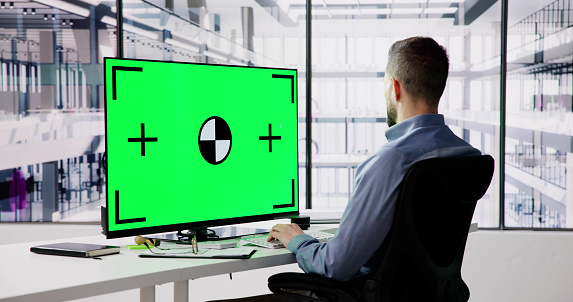 Blank Desktop Computer Screen In Office. Man Looking At Job Screen