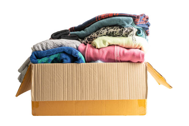 istock Donation box with used clothes isolated on white background with clipping path to support help for poor people in the world. 1954718466