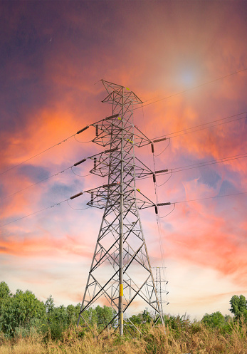 High-voltage power lines at sunset,high voltage electric transmission tower