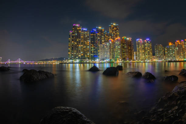 Buildings, sea, rocks, purple bridge, tourist attractions of Busan, very beautiful at night.