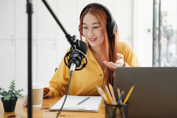 istock Live Podcast Session with Smiling Female Host 1954776288