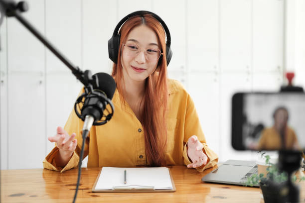 istock Live Podcast Session with Smiling Female Host 1954776298