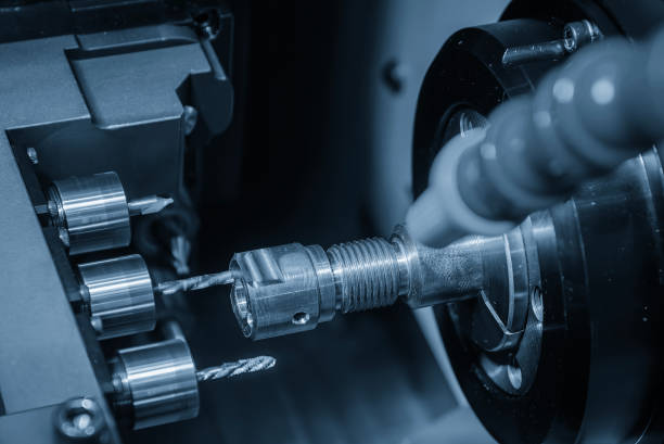 istock The  multi tasking CNC lathe machine swiss type drilling the brass fitting parts. 1954779272