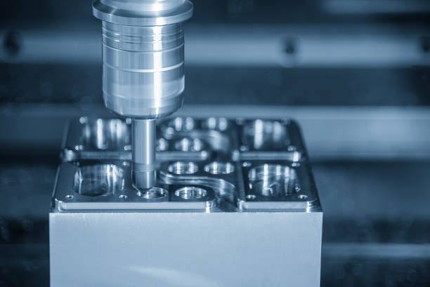 istock The CNC milling machine chamfer cutting mold base part by chamfer tool in the light blue scene. 1954780967