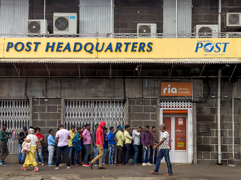 Port Louis, Mauritius - August 5th, 2023 - People waiting in line at the post office headquarters.