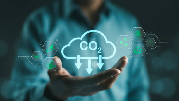 istock Carbon footprint concept. Man hand holding carbon reduction icon. Net zero and carbon neutral, Carbon emissions, CO2 neutrality, Sustainable energy, Climate change, Global warming, Greenhouse gas, 1954820501
