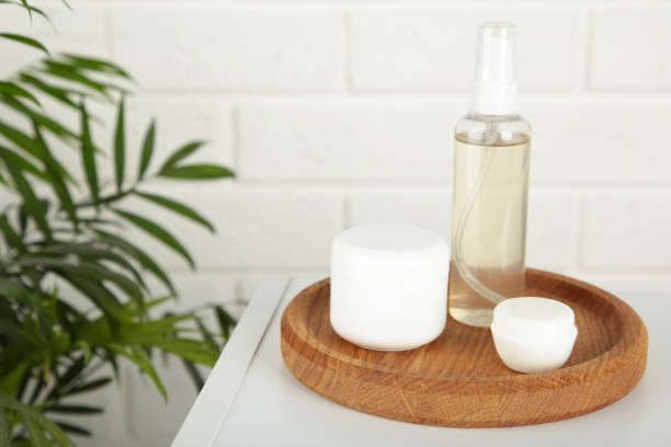 istock Natural cosmetic products on light background. Cream, mask, lotion for face on table. 1954872045