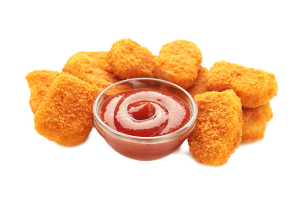 istock Tasty chicken nuggets with ketchup isolated on white 1954875289