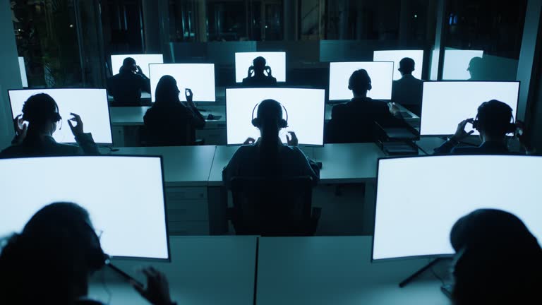 Call centre, control room or people with mockup or headset for computer, customer service or telecom. Night, end or back of agents in command center for space on monitor screen for surveillance help