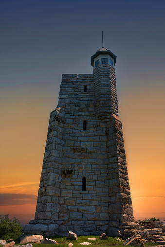 Sun setting over Skytop Lookout Tower, sits at the top of Mohonk Mountain in New Paltz, New York.
