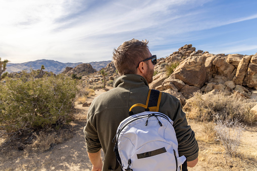 He enjoys the nature in a simple way, walking in the beautiful desert.