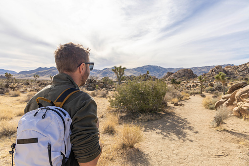 He enjoys the nature in a simple way, walking in the beautiful desert.