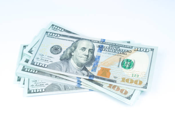 istock New design US Dollar bills bundles stack on white background including clipping path. 1954944637
