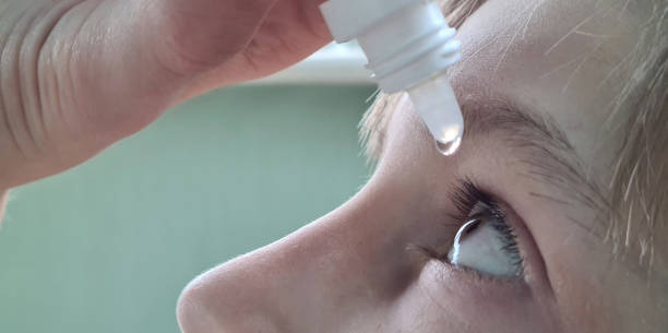 istock Child face looks up close and drips eye drops into eyes 1954968506