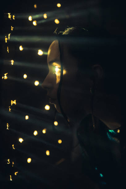 Woman looks through a hole that emanates lightCinematic photo