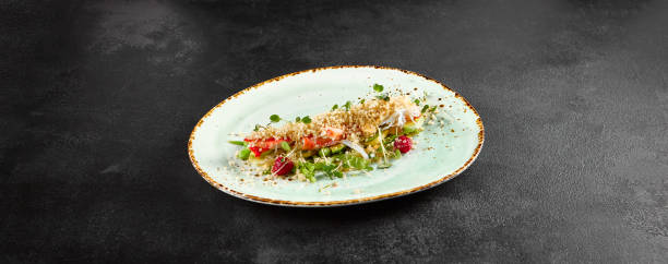 istock Salad with avocado, crab, and quinoa on a speckled turquoise plate 1955010276
