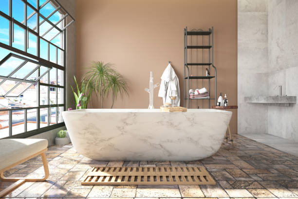 istock Cozy Pastel Colored Bathroom with Marble Bathtub 1955027206