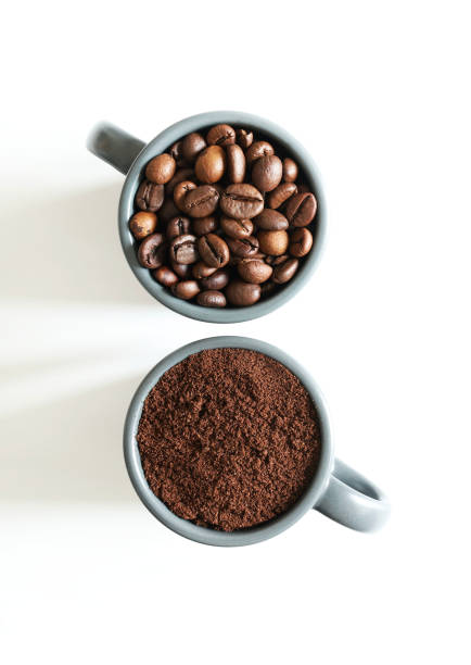 istock Coffee cups with coffee beans and ground coffee. 1955033531