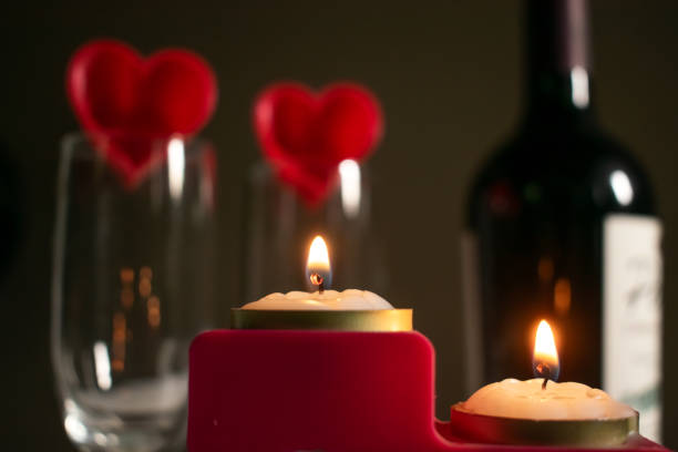 istock two red hearts with burning candles 1955043026