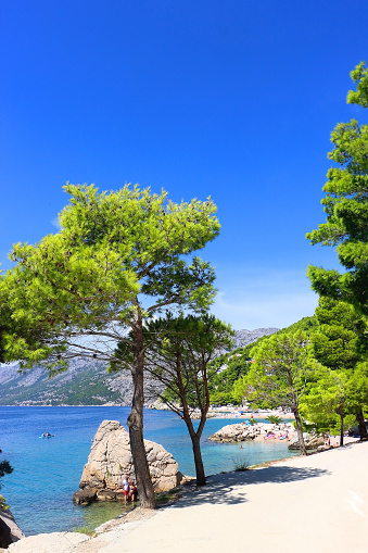 Brela, Croatia - September 3, 2023: Summer day on the beautiful beach in Brela, Croatia.