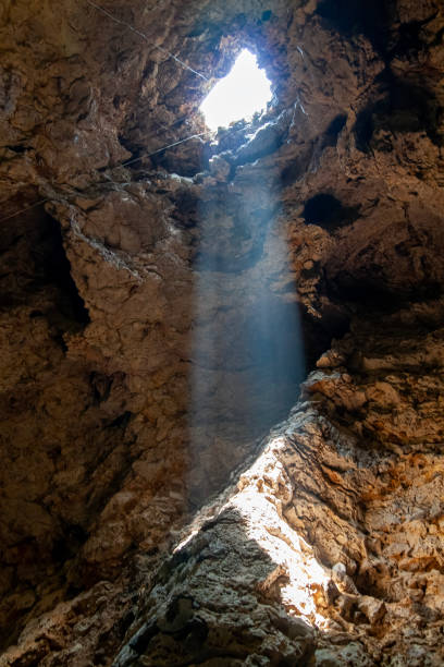 the Sun beam light through hole in the cave at thailand