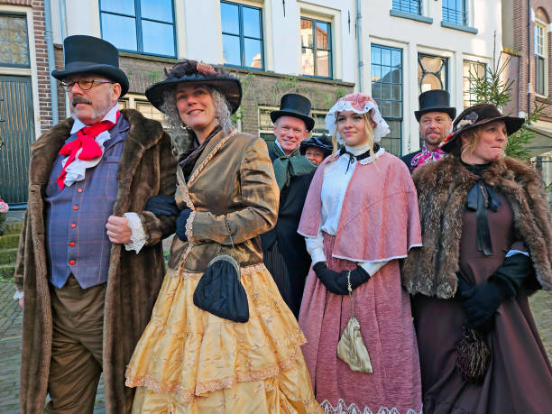 people in the streets of deventer in victorian style cloting during the dickens festival - 0 3 months стоковые фото и изображения