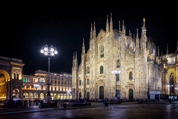 istock Holidays in Italy - Piazza Duomo in Milan by night 1955113675