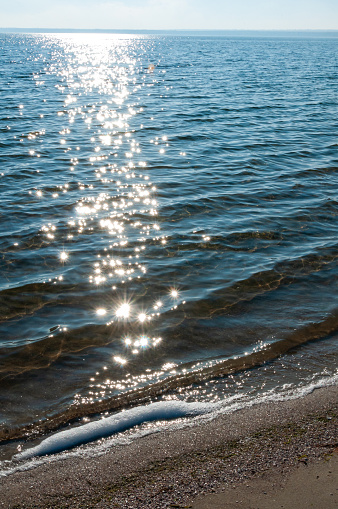 Sun glare on the water near the sandy spit in Tiligul estuary, Ukraine