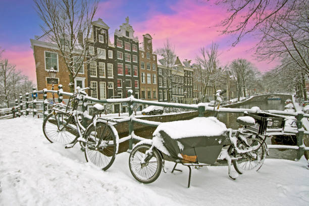 istock Amsterdam in winter in the Netherlands at sunset 1955155947