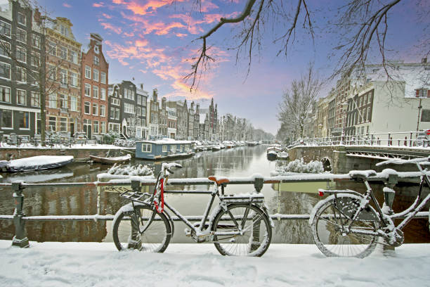 istock Amsterdam in winter in the Netherlands at sunset 1955157149