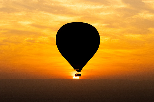 Hot balloon sunrise in Luxor, egypt, also temples