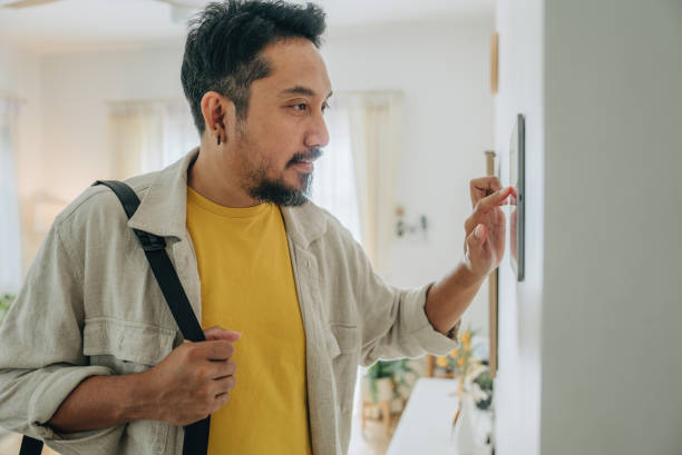 istock Asian man professional using smartphone at home, Bangkok, Thailand 1955180851