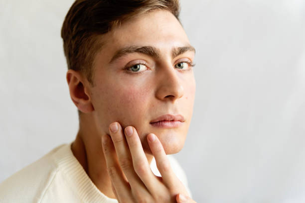 istock Portrait of androgynous young man on white background. 1955198920