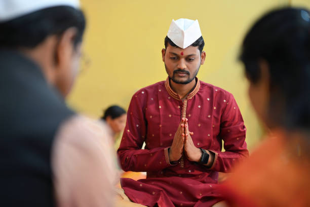 istock Groom with folded hands during his wedding ceremony 1955208745