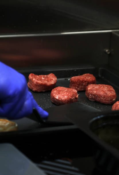 istock professional chef cooking grilled hamburger meat 1955239489