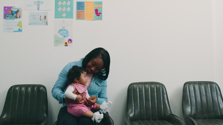 Energetic Baby in her Mother's Arms