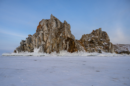 Olkhon Island. snowy frosty winter. Shamanka Rock sunset