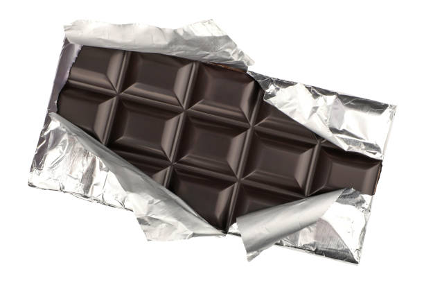 istock dark chocolate isolated on a white background. dark chocolate wrapped in an aluminum package. clipping path. 1955307604