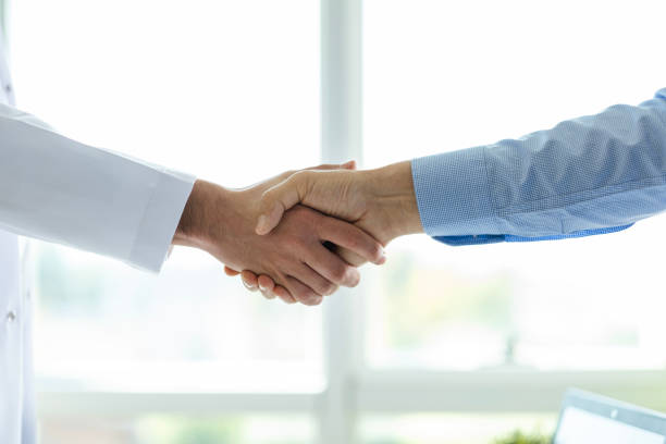 istock Close-up Doctor and patient shaking hands 1955338970